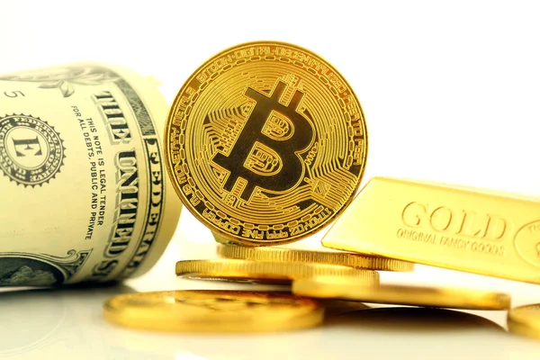 Physical version of Bitcoin, new virtual money. Conceptual image for investors in cryptocurrency, gold and dollars.