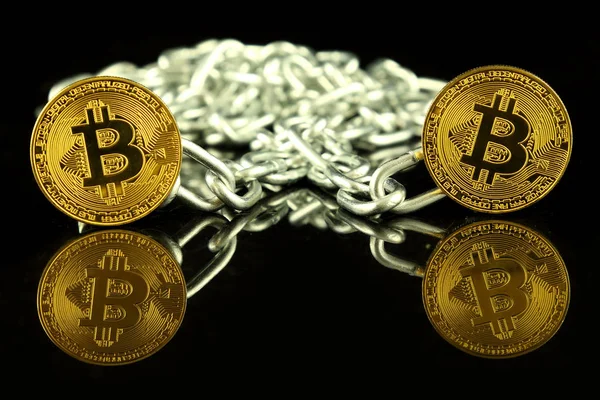 Physical version of Bitcoin (virtual money) and chain. Conceptual image for Blockchain Technology and hard fork (term refers to a situation when a blockchain splits into two separate chains). — Stock Photo, Image