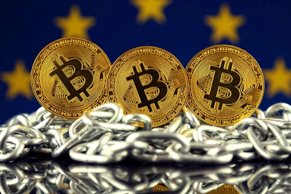 Physical version of Bitcoin (new virtual money), chain and EU Flag. Conceptual image for investors in cryptocurrency and Blockchain Technology in European Union. — Stock Photo, Image