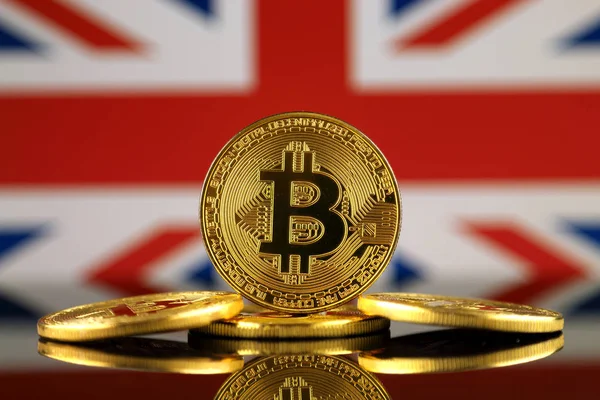 Physical version of Bitcoin (new virtual money) and UK Flag. Conceptual image for investors in cryptocurrency and Blockchain Technology in United Kingdom. — Stock Photo, Image