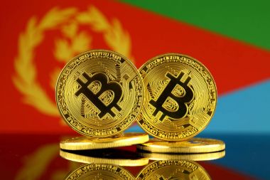 Bitcoin ve Eritre bayrak fiziksel sürümü. Yakın çekim.