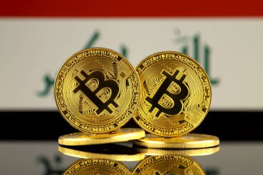 Bitcoin ve Irak bayrağı fiziksel sürümü. Yakın çekim.