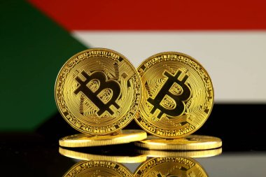 Bitcoin ve Sudan bayrağı fiziksel sürümü. Yakın çekim.