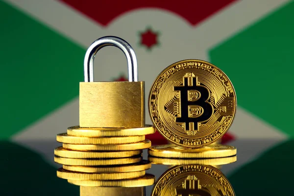 Bitcoin, altın asma kilit ve Burundi bayrağı fiziksel sürümü. Cryptocurrencies, yönetmelikler, kısıtlamaları veya güvenlik, koruma, gizlilik yasaklanması.