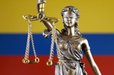Symbol of law and justice with Colombia Flag. Close up. clipart
