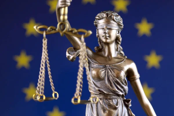 Symbol of law and justice with European Union Flag. Close up.