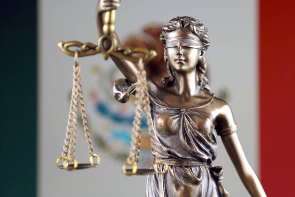 Symbol of law and justice with Mexico Flag. Close up.
