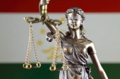 Symbol of law and justice with Tajikistan Flag. Close up.