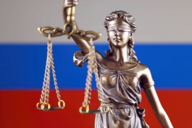 Symbol of law and justice with Russia Flag. Close up. clipart