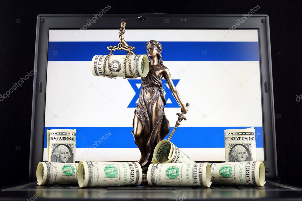 Symbol of law and justice, banknotes of one dollar and Israel Flag on laptop. Studio shot.