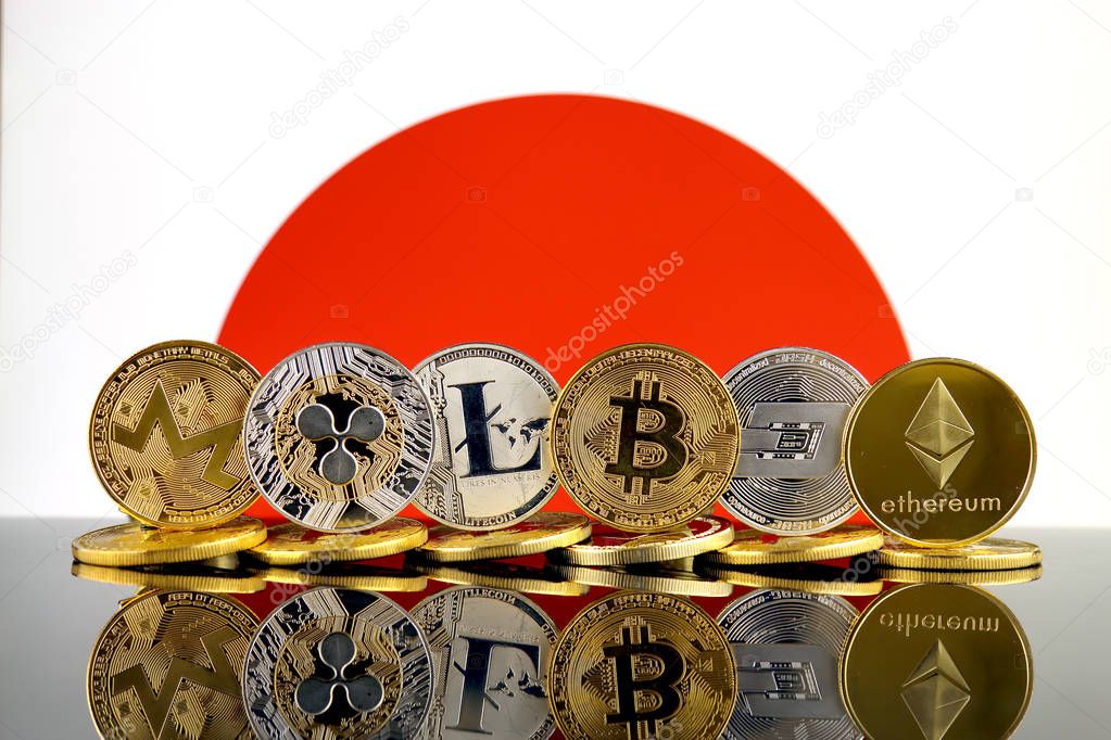 Physical version of Cryptocurrencies (Monero, Ripple, Litecoin, Bitcoin, Dash, Ethereum) and Japan Flag.