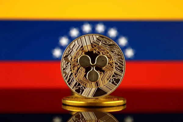 Physical version of Ripple (XRP), new virtual money and Venezuela Flag. Conceptual image for worldwide cryptocurrency and digital payment system. Studio shot.