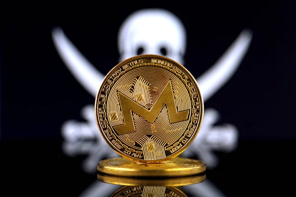 Physical version of Monero (XMR), new virtual money and Pirate Flag. Risk, safety and security. Studio shot.