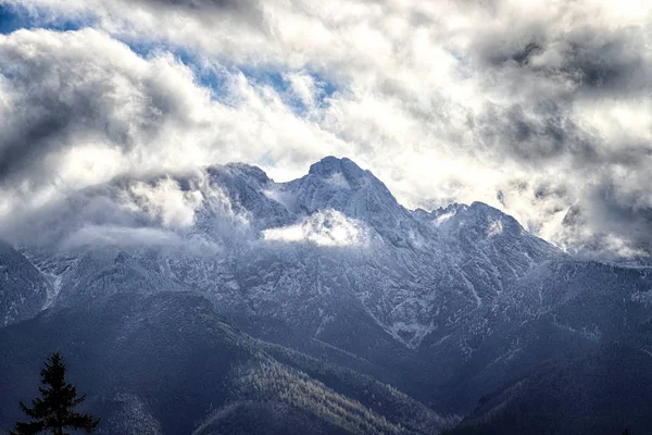 ZAKOPANE, POLAND - NOVEMBER 06, 2019: Tatra National Park in autumn. Landscape with sun and clouds in Polish Tatra Mountains early morning, Zakopane, Poland, Europe.