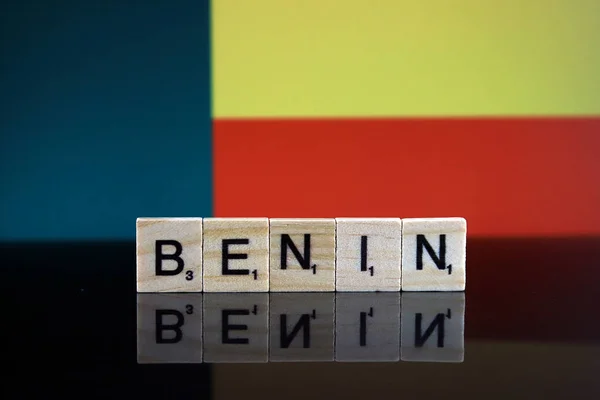 Benin Flag and country name made of small wooden letters. Studio shot.