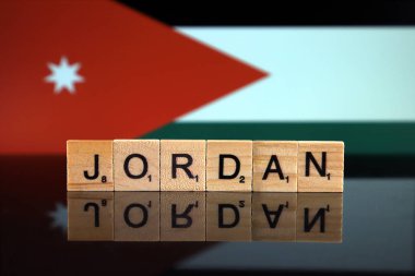 Jordan Flag and country name made of small wooden letters. Studio shot.