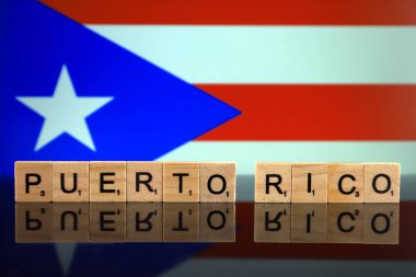 Puerto Rico Flag and country name made of small wooden letters. Studio shot.