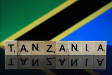 Tanzania Flag and country name made of small wooden letters. Studio shot.