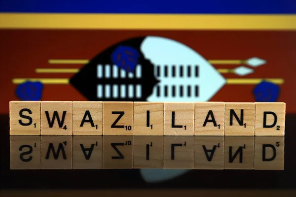 Swaziland Flag and country name made of small wooden letters. Studio shot.