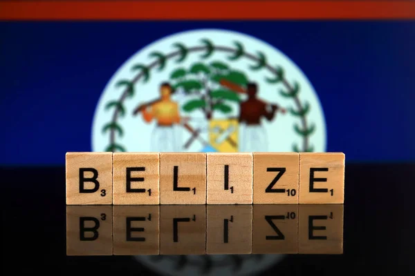 Belize Flag and country name made of small wooden letters. Studio shot.