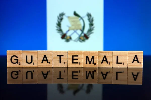 Guatemala Flag and country name made of small wooden letters. Studio shot.