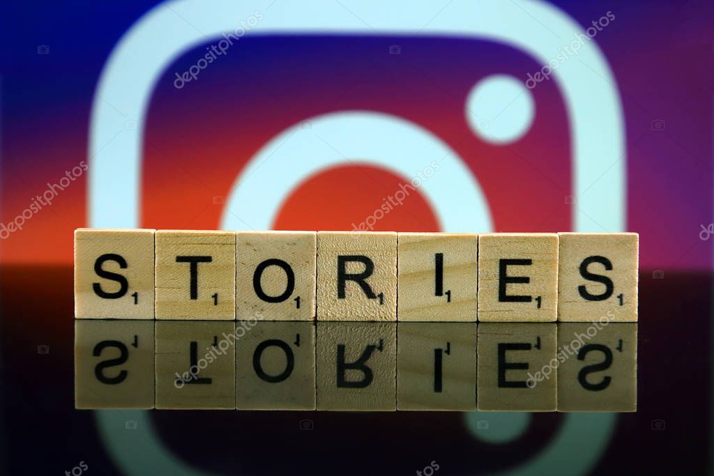 WROCLAW, POLAND - FEBRUARY 12, 2020: Word STORIES made of small wooden letters, and INSTAGRAM logo in the background. Studio shot.