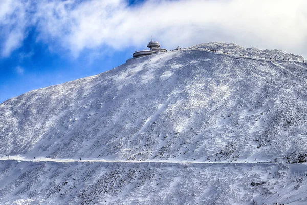 KARPACZ, POLAND - MARCH 08, 2020: Snezka or Sniezka (in Czech and Polish) is a mountain on the border between the Czech Republic and Poland. Winter landscape. Giant Mountains, Poland, Europe.