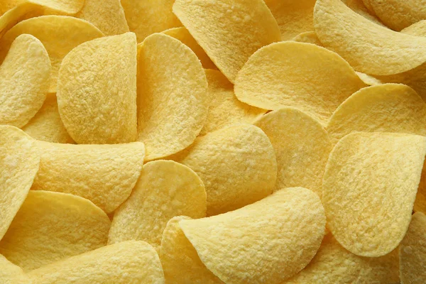 Hintergrund der schönen großen Chips Nahaufnahme golden — Stockfoto