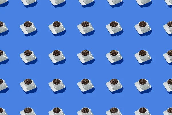 Seamless pattern cup of coffee on trendy blue background, isometric style. Use for printing. View from above. Top view