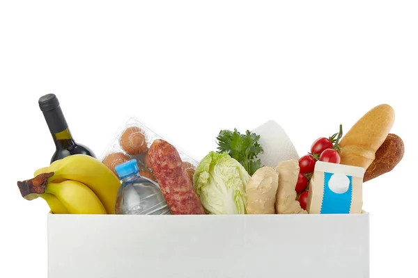 Veilige thuisbezorging. Doos met verschillend voedsel op een witte achtergrond. donatieconcept — Stockfoto