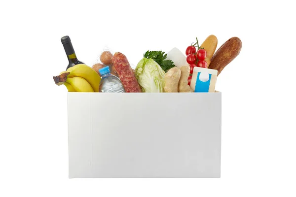 흰 배경에 다른 음식이 놓인 상자. 기부 개념. 안전 한 가정 분만. 스톡 사진