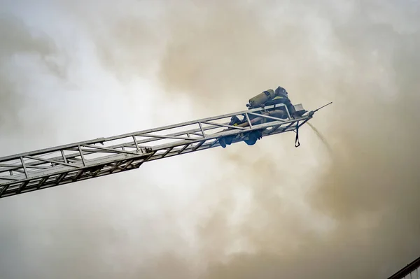 Firefighter Puts Out Burning Building Height Extension Ladders Stock Photo