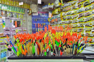 Fishing tackle with colored floats close-up in a fishing shop Russia, Kursk region, Zheleznogorsk October 2019 clipart