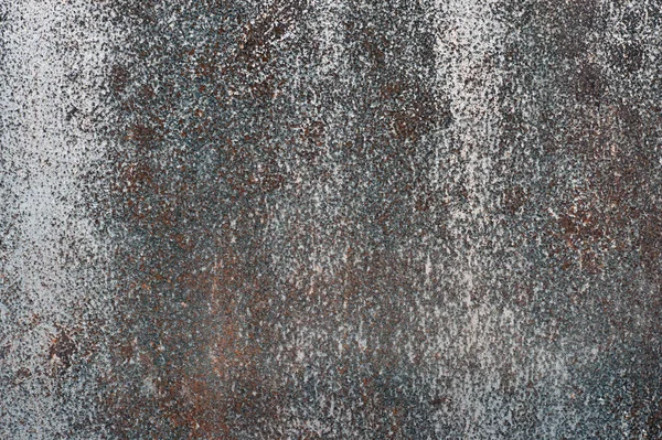 Superficie metálica oxidada con restos de pintura descolorida. Fondo abstracto — Foto de Stock