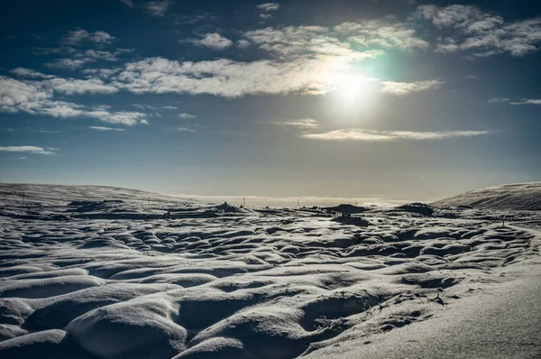 Chrismas Winter Landscape with Sun blue Sky and Snow in Iceland