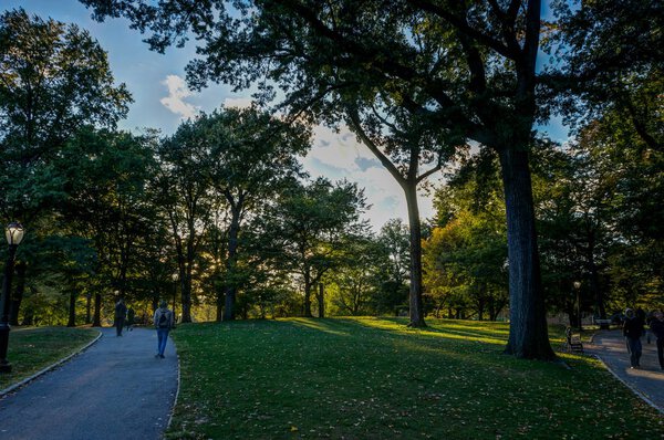 Photo taken in New York USA, August 2017: New York Central Park Sunset blue Sky trees Manhatten