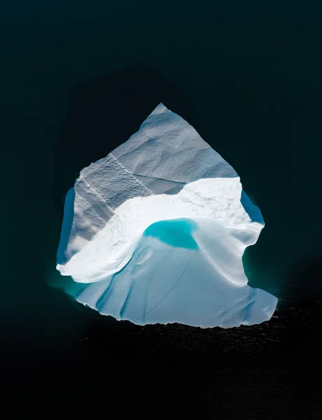 Icebergs drone aerial image top view - Climate Change and Global Warming. Icebergs from melting glacier in icefjord in Ilulissat, Greenland. Arctic North Pole nature ice landscape in Unesco World — Stock Photo, Image
