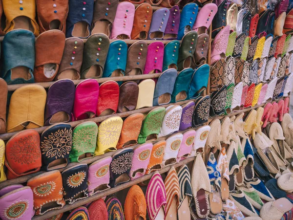 Colorful handmade leather slippers babouches on a market souk in the medina of Marrakech, Morocco