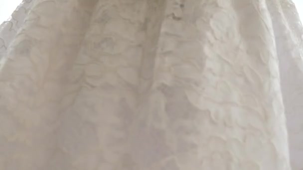 Close-up, 4k, slow-motion, the girl is spinning in a white lace dress. — Stock Video