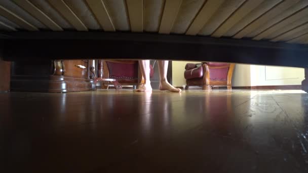 4k, female legs, view from under the bed. the woman goes to bed — Stock Video