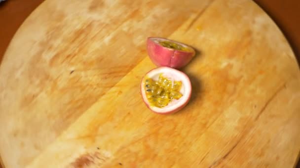 Exotic fruits on the table. 4k. passion fruit, rotates on a cutting board. — Stock Video