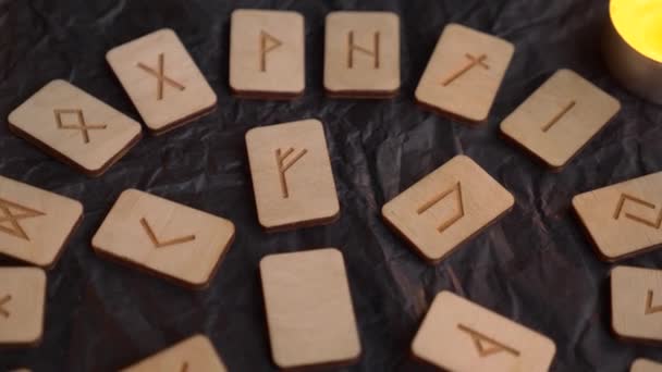 Wooden rune wheel. runic layout and candles, 4k, slow-motion shooting — Stock Video