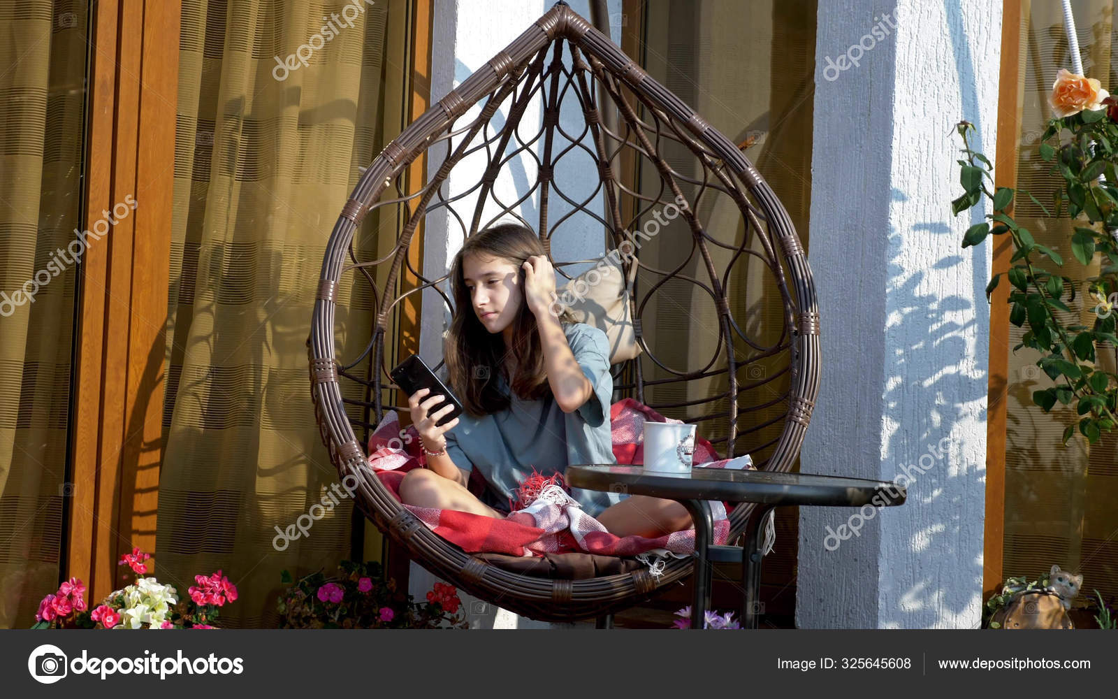 Cute Teen Girl Resting In A Rocking Chair In The Back Yard Using A Cell Phone Stock Photo Image By C Expsycholog Gmail Com 325645608