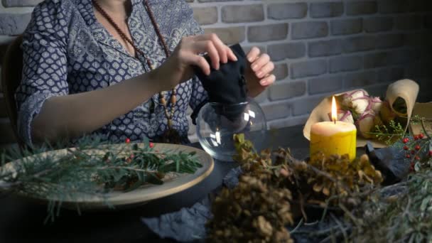 Pagan ritual magic. a potion of herbs. the woman is a witch preparing herbal — 비디오