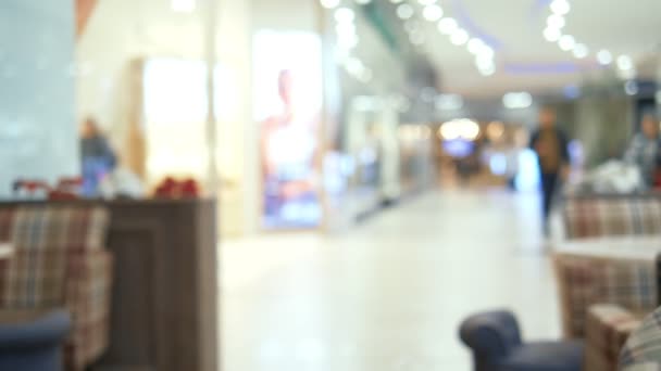 Blurred background hall and dining room of a huge modern supermarket. copy space — Stock Video