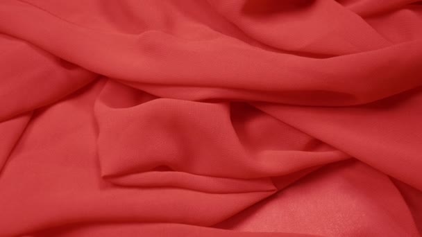 Background fabric texture. waves of red silk fabric closeup. copy space — Stock Video