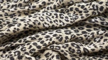 Kumaş arka planı. Hayvan desenli leopar desenli kumaşlar. Boşluğu kopyala