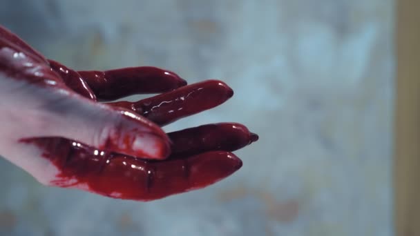 Bloody hands, blood dripping from his hands. copy space — Stock Video