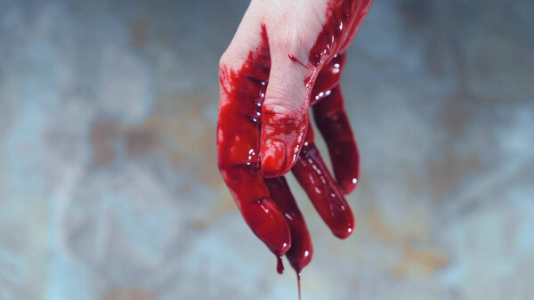 bloody hands, blood dripping from his hands. copy space
