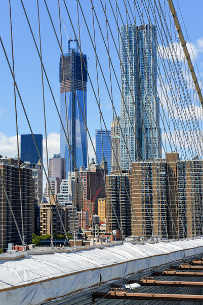 View of the New York City Skyline from the Brooklyn Bridge.